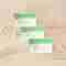 Pevonia Professional Ampoule boxes sitting sitting behind one another on a beige background.